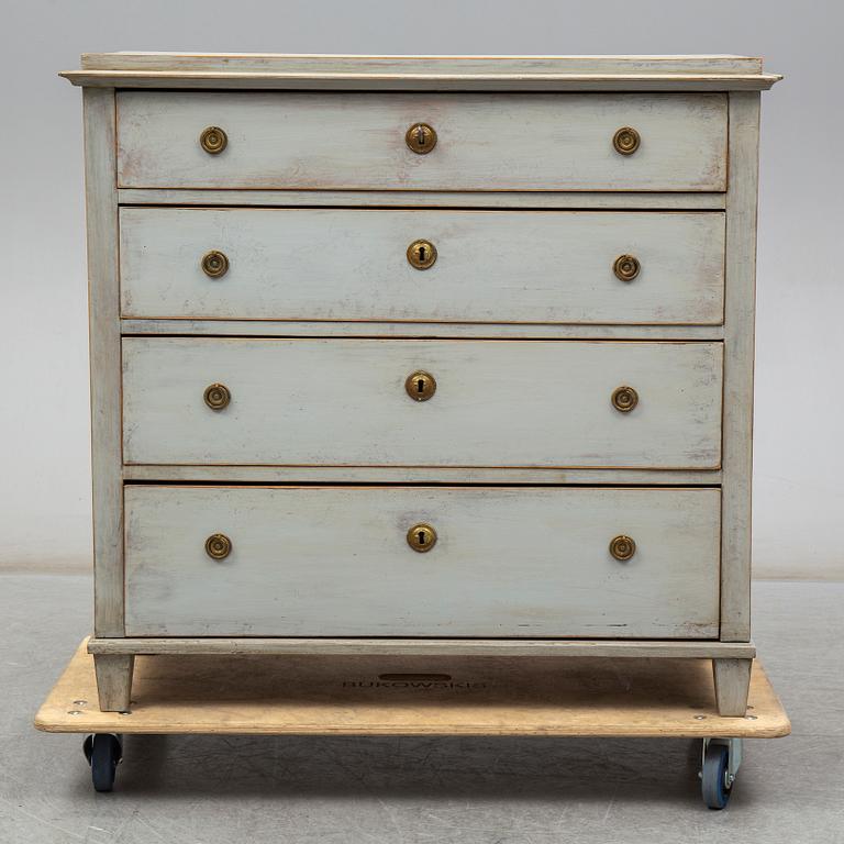 a chest of drawers from the first half of the 19th century.