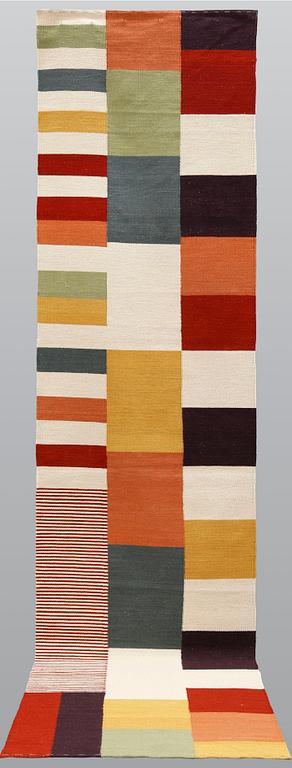 An oriental flat weave runner, approximately 389 x 77 cm.