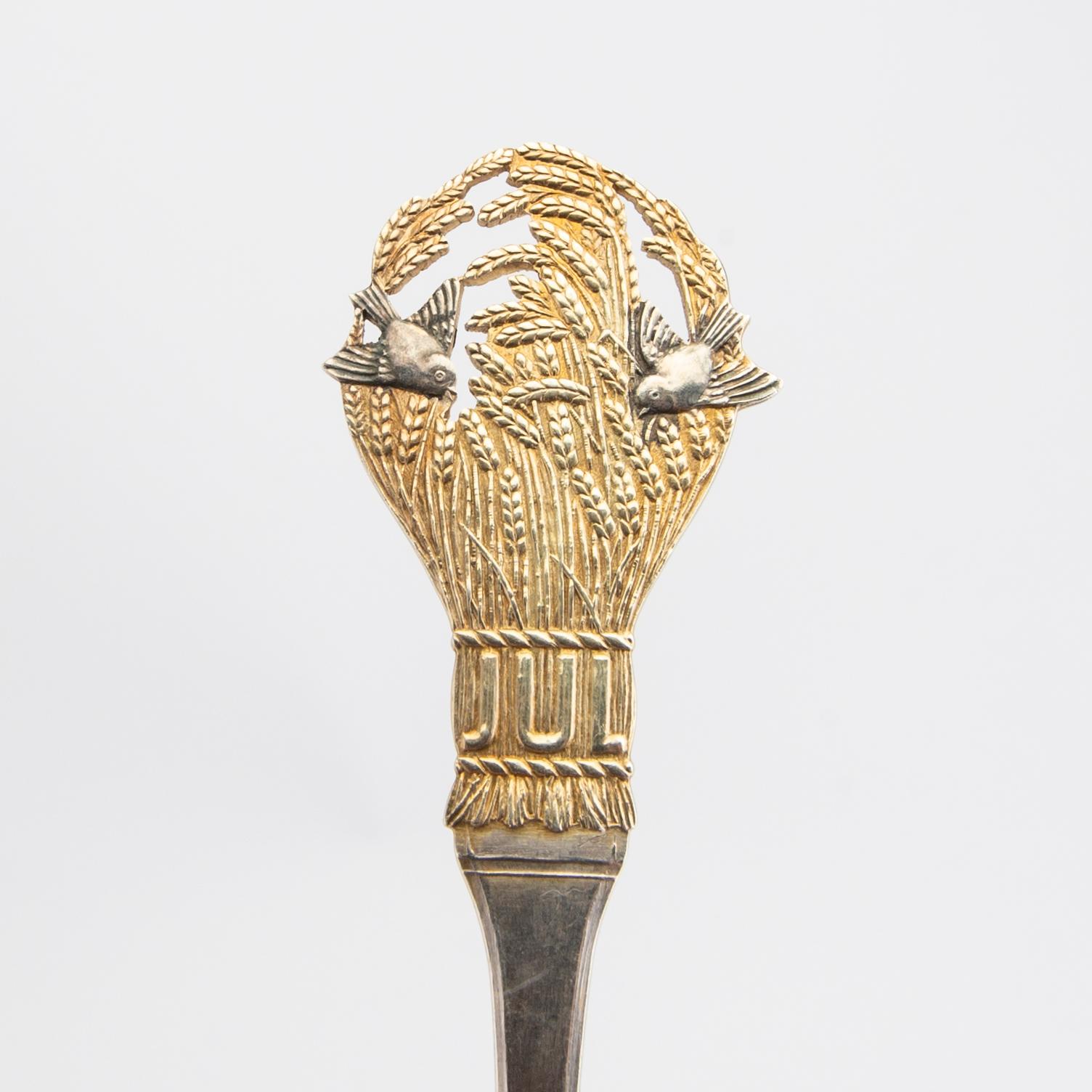 Anton Michelsen, Christmas cutlery, 21 pieces, gilded sterling silver and enamel, Denmark total weight 888 grams.