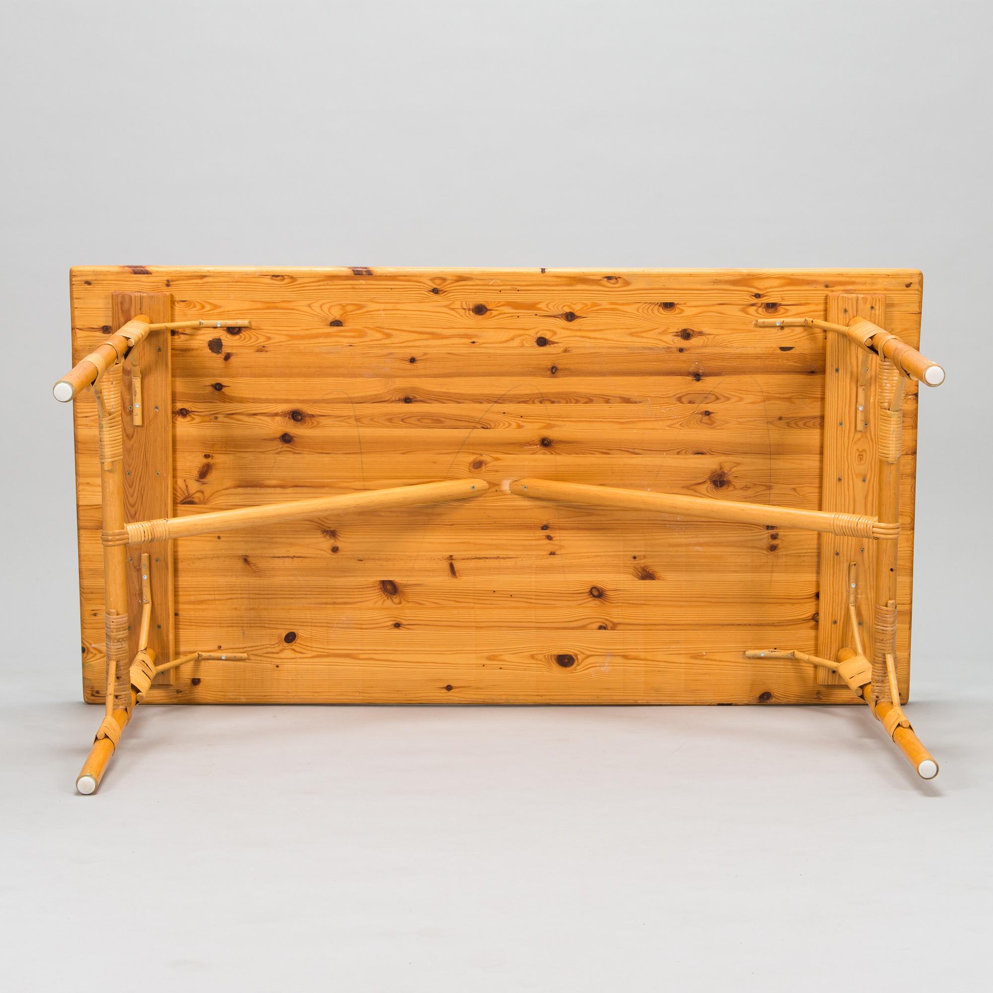 A pine wood and rattan table, late 20th century.