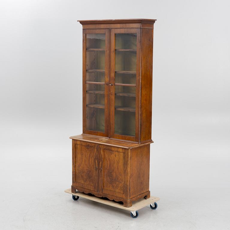 A 19th century walnut veneered  book cabinet.