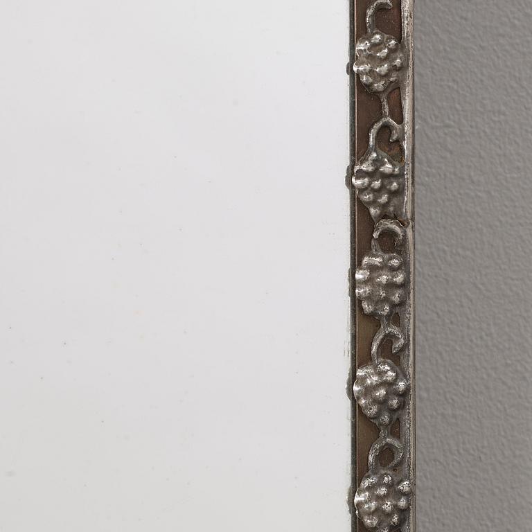 Nils Fougstedt, a pewter and brass mirror, Stockholm, dated 1949.