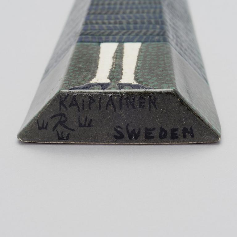 BIRGER KAIPIAINEN, A CERAMIC WALL RELIEF. Big doll. Signed Kaipiainen R Sweden.