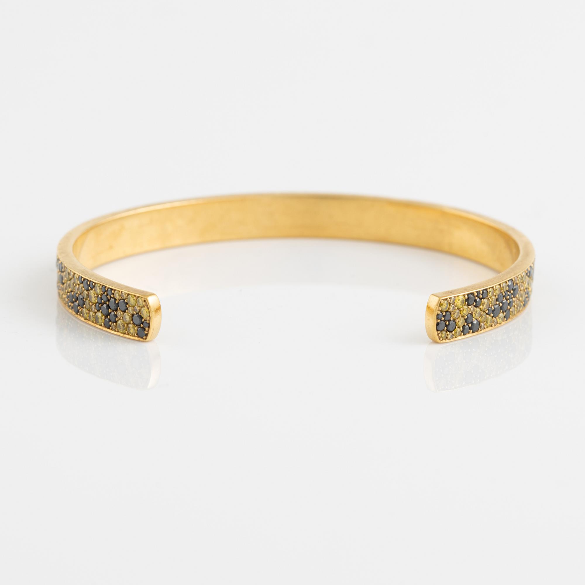 Crow's nest jewels, gold, black and yellow diamond and pear shaped tsavorite bangle.