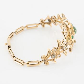 Necklace and bracelet in with floral motif set with cabochon-cut emeralds and rose-cut diamonds.
