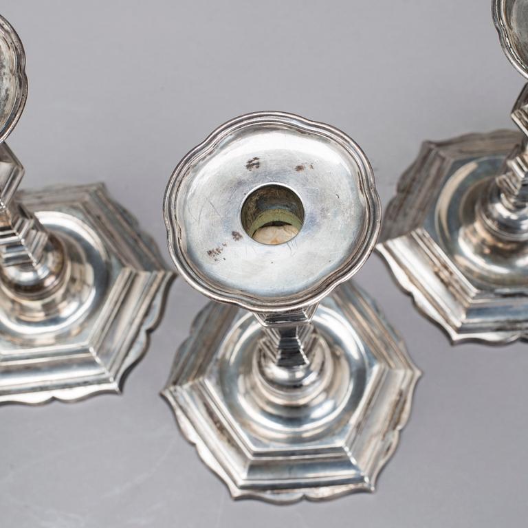 Two simular pairs of candlesticks, two marked Barde, Geneve 18th century, two with later marks.