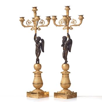 A pair of French Empire early 19th century five-light candlesticks.