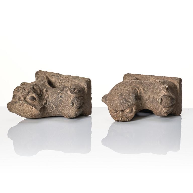 A pair of stone sculptures of buddhist lions, Qing dynasty (1664-1912).