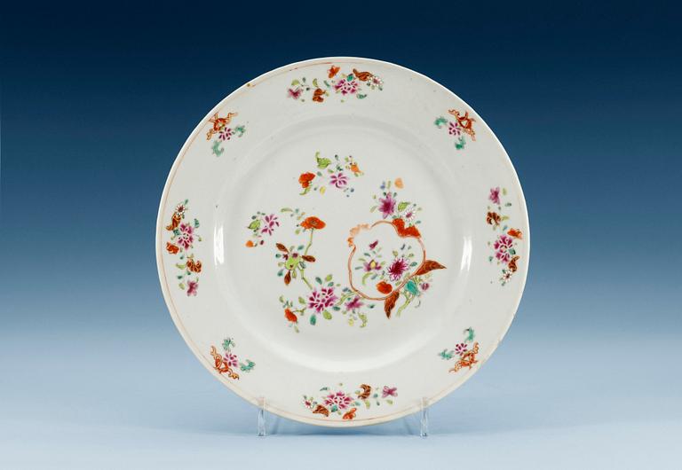 A set of nine famille rose dinner plates, Qing dynasty, Qianlong (1736-95). (9).