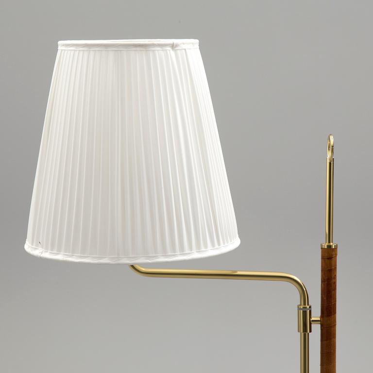 A brass and leather floor light by Örsjö industri, 21st century.