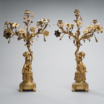 A PAIR OF CANDELABRAS, gilt bronze, France second half of the 19th century.