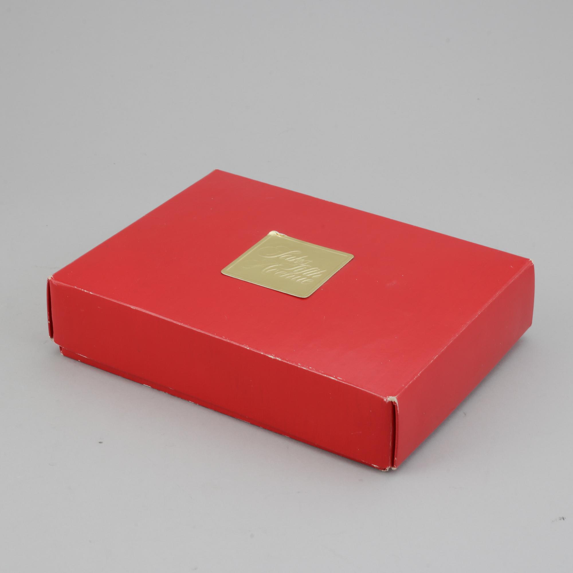 Judith Leiber, a vintage evening clutch from Saks Fifth Avenue.