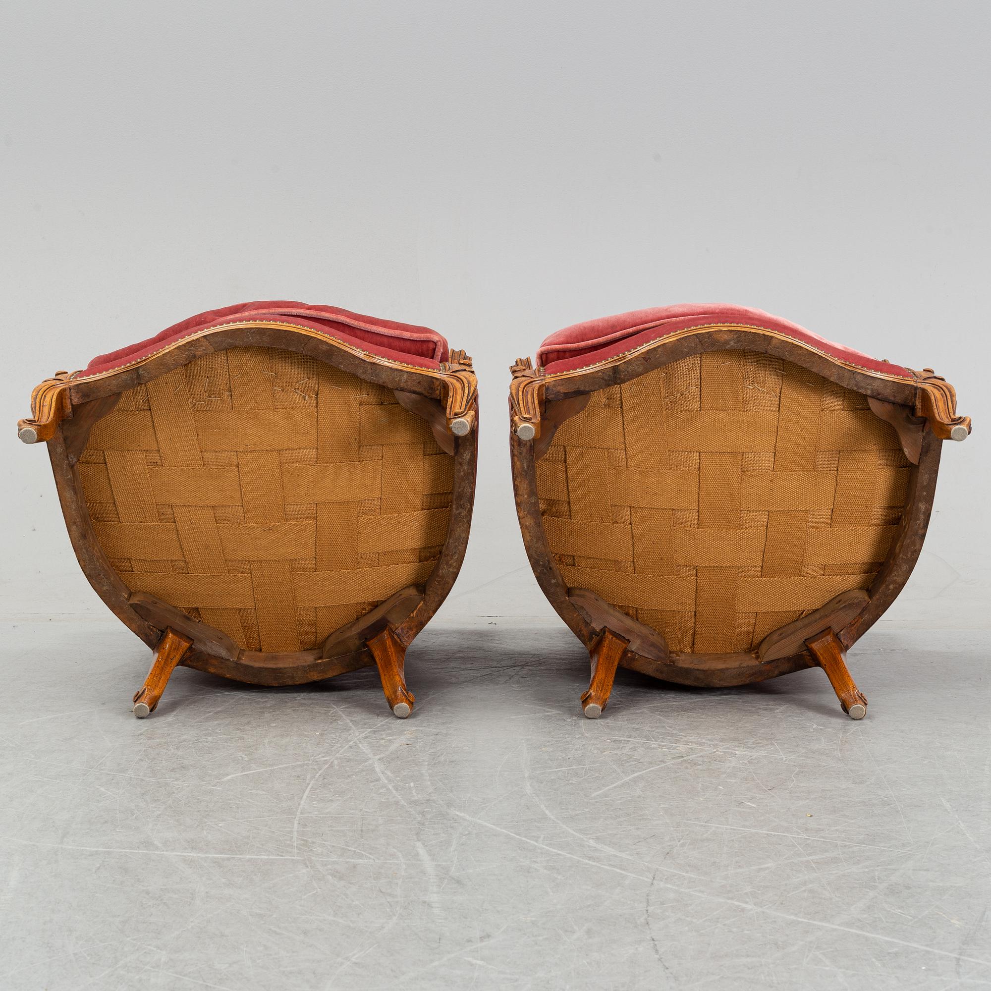 A pair of rococo style easy chairs from around the year 1900.