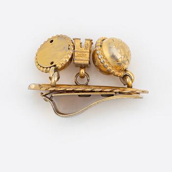 Céline, a set of four gold tone brooches.