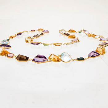 An 18K gold necklace set with various faceted gemstones, possibly H.Stern.