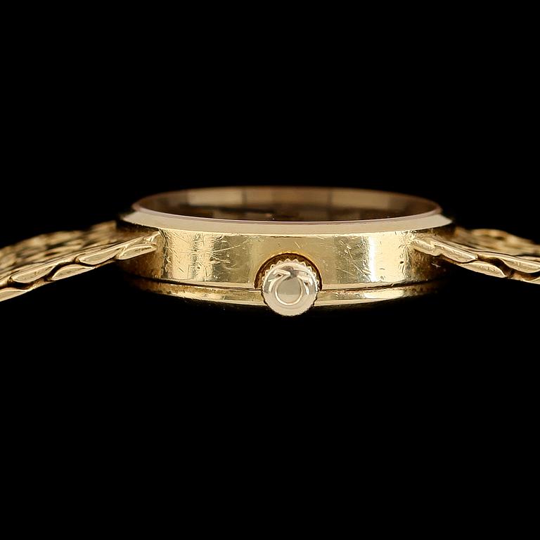 DAMARMBANDSUR, 18K guld, Omega, 1900-talets andra hälft. Total vikt med urverk ca 36 g.