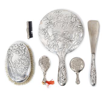 A Chinese toilette set, silver and white metal, early 20th century.
