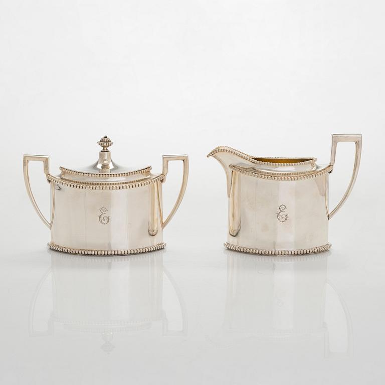 An early 20th century 4- piece sterling silver empire coffee set, C.G. Hallbergs Guldsmeds AB, Stockholm.