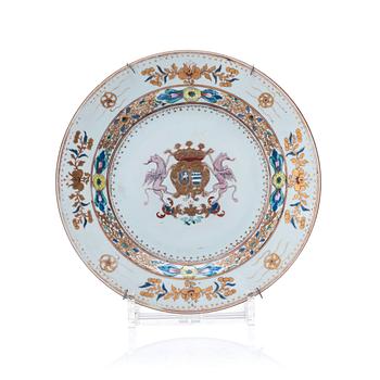 1052. A famille rose armorial dinner plate, Qing dynasty, 18th Century.