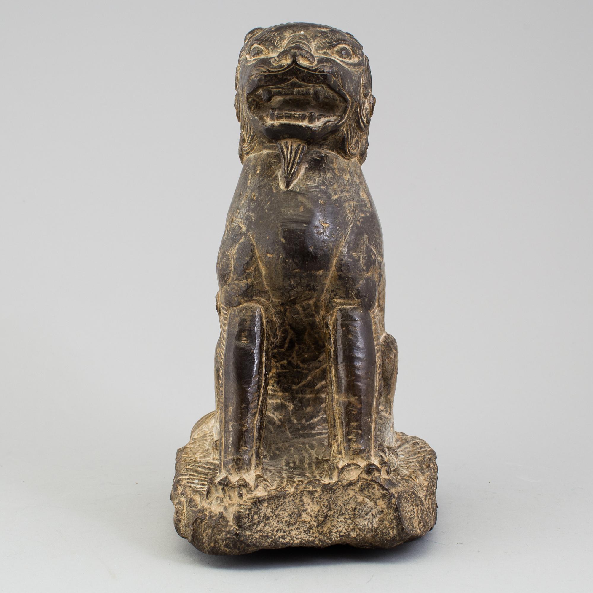 A stone sculpture of a mythical beast, China, 20th Century.