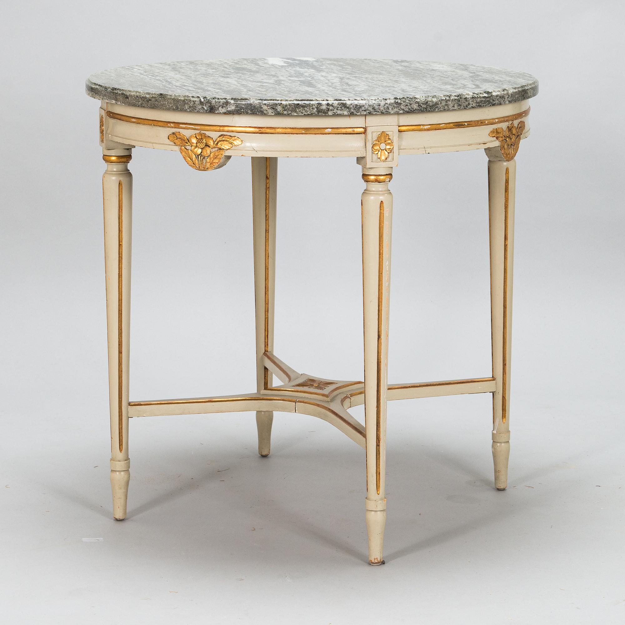 A Gustavian style sofa and table from early 20th century.