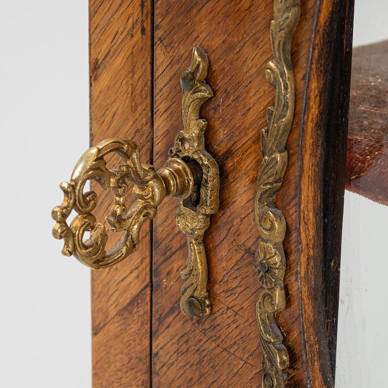 A 19th century, Rococo style display cabinet.