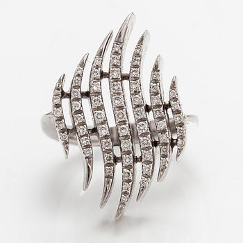 A pair of 18K white gold earrings and a ring with diamonds ca. 0.90 ct in total. Moscow.