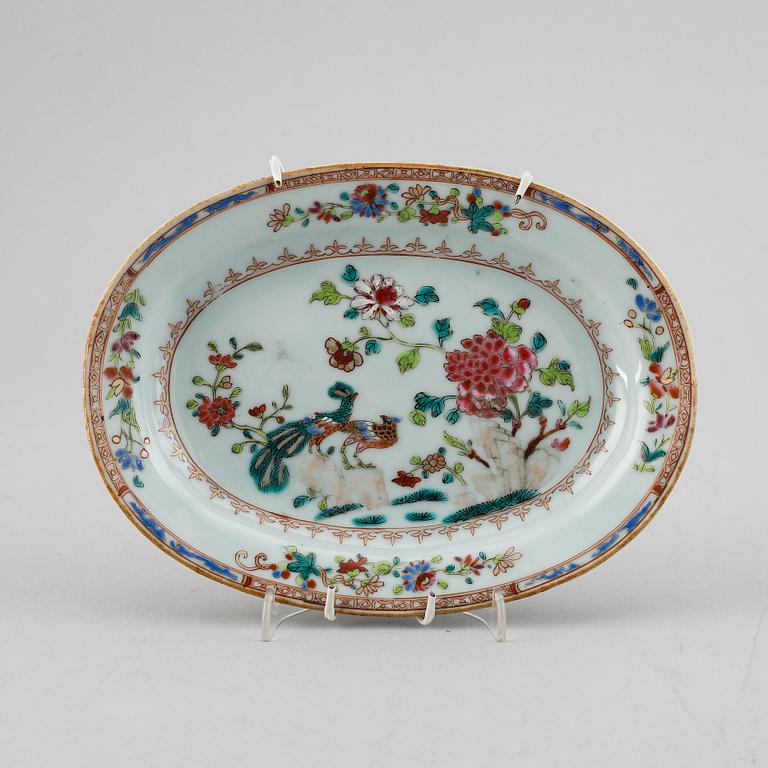 An oval famille rose doubel peacock dish for a butter tureen, Qing dynasty, Qianlong (1736-95).