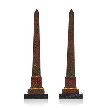 200. A pair of red and black marble obelisks, 20 th century.