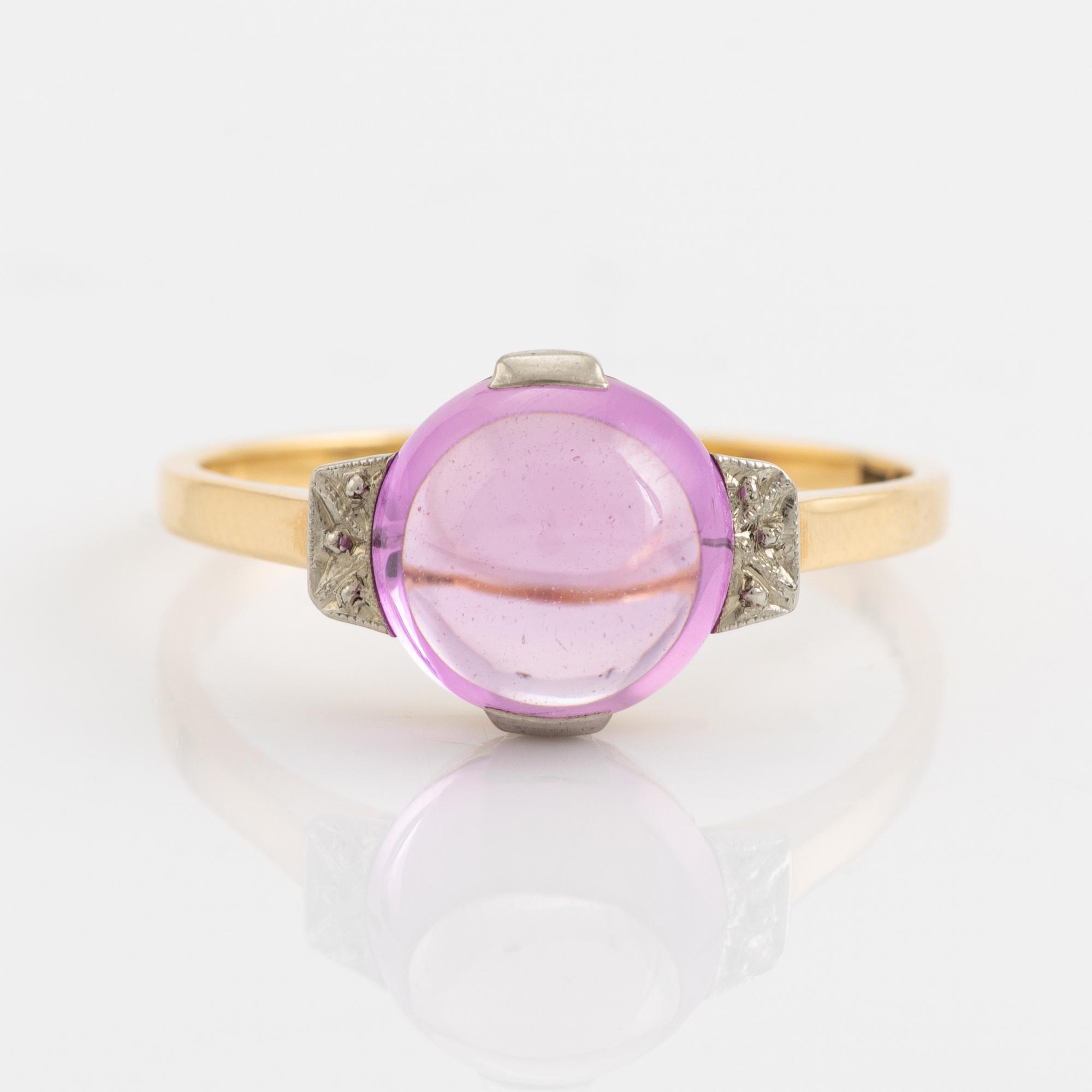 18K gold and cabochon cut syntehtic pink sapphire.