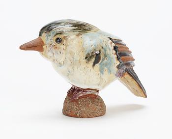 A Tyra Lundgren stoneware bird, signed with a seal.