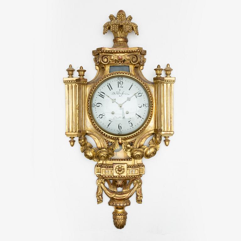 A Gustavian wall clock marked Daniel Herrström (active in Stockholm 1788-1790).