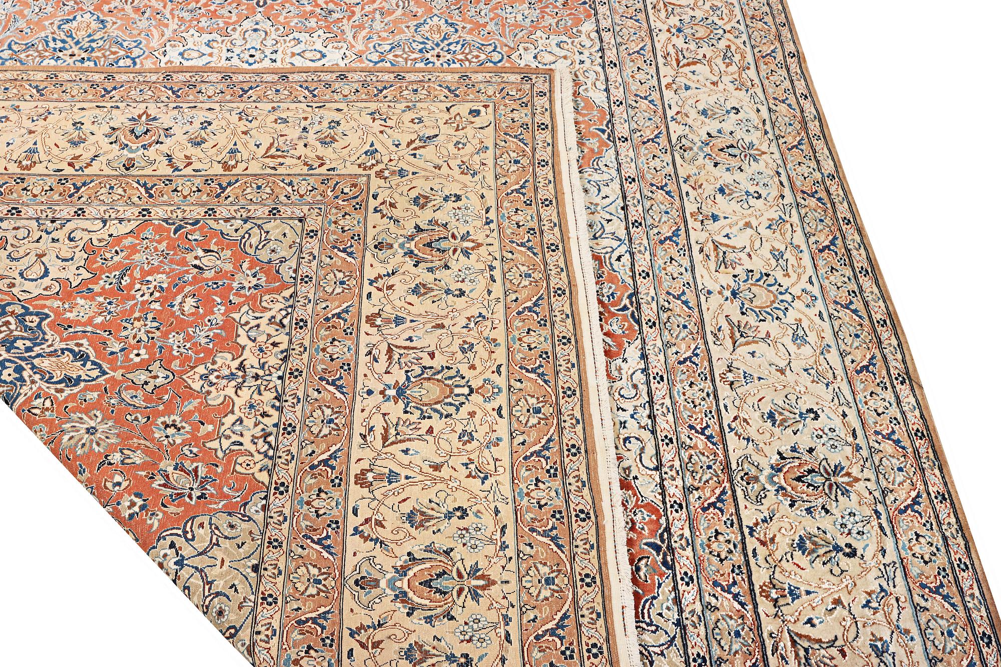A semi-antique/old Nain carpet, part silk, c. 343 x 230 cm.