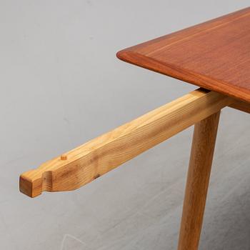 A 1950/60's dining table from Slagelse Møbelvaerk A/S with two additional leaves.