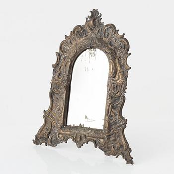 A Louis XV silvered-brass dressing-mirror, mid 18th century.