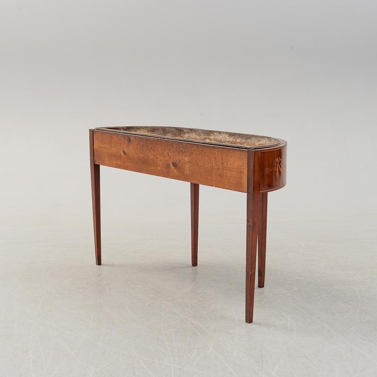 A late 19th century mahogany flower table.