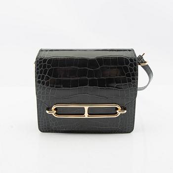 Hermès, bag "Green Shiny Alligator Mini Roulis 18 Permabrass Hardware" 2021.