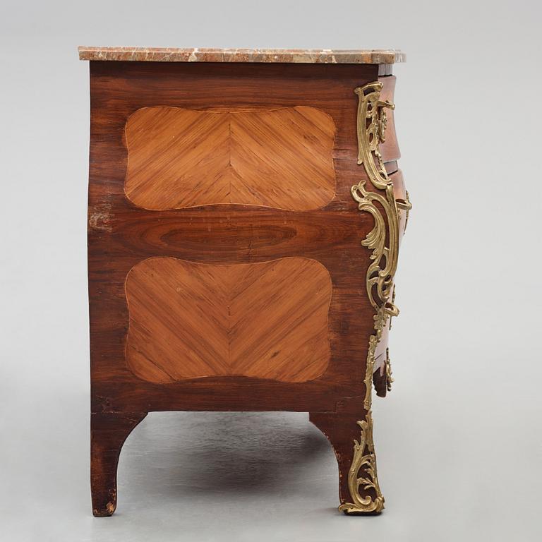 A Louis XV ormolu-mounted amaranth and rosewood marble top commode, mid 18th century.