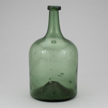 A 18th or 19th century glass bottle.