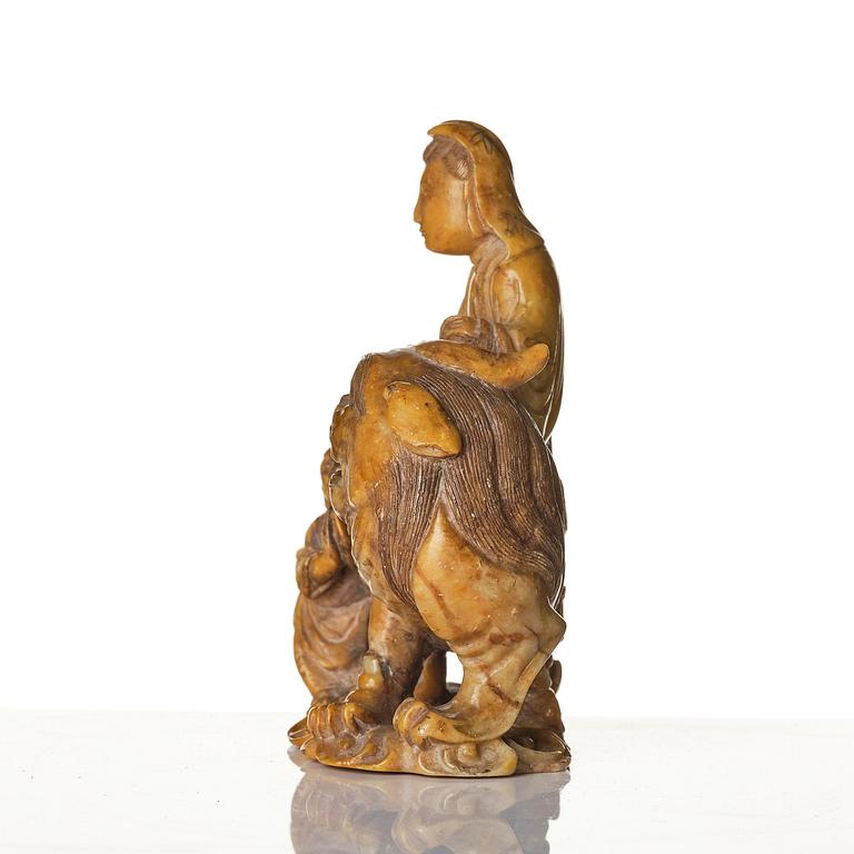 A well carved soapstone sculpture of Guanyin seated on Xiezhai, Qing dynasty, 18th/19th century.