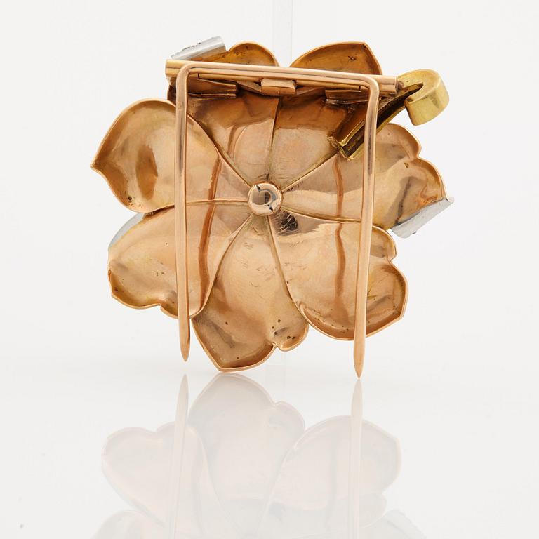 A 1940/50s brooch by Boucheron, in the shape of a flower, set with brilliant cut diamonds.