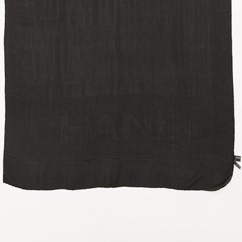 A silk scarf by Chanel.