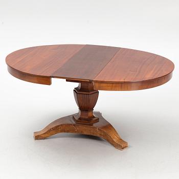 A dining table, late 19th Century.