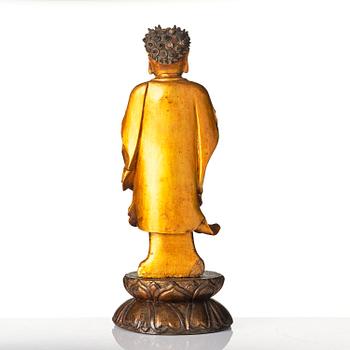 A lacquer figure of a standing Buddha, late Ming dynasty/early Qing dynasty.