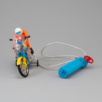 A 1970s battery operated toy racing auto cycle,Original "Junior" Product, Japan.