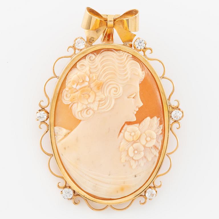 Pendant/brooch in 18K gold with shell cameo and white stones.
