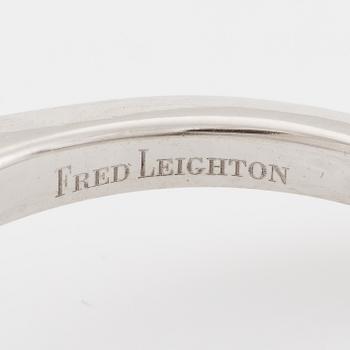 Ring, Fred Leighton platinum with an oval faceted tanzanite and fancy-cut diamonds.