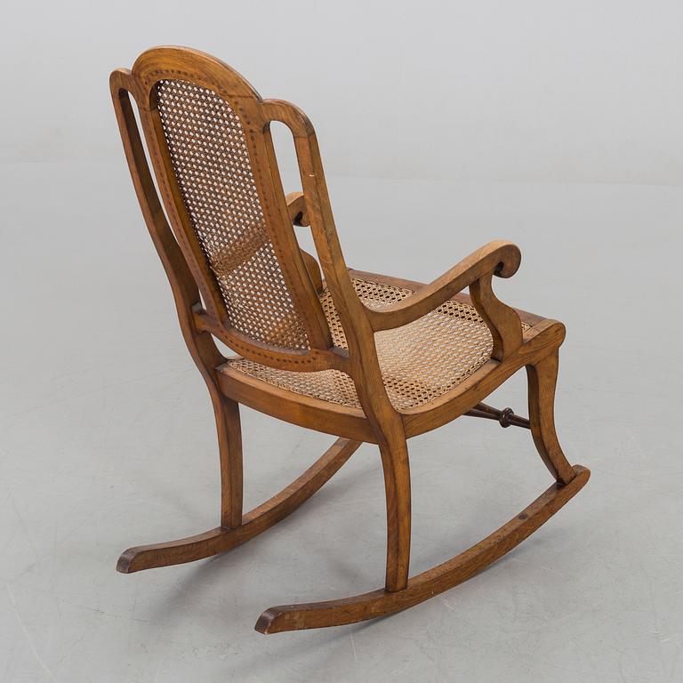 A ROCKING CHAIR LATER PART OF THE 19TH CENTURY.
