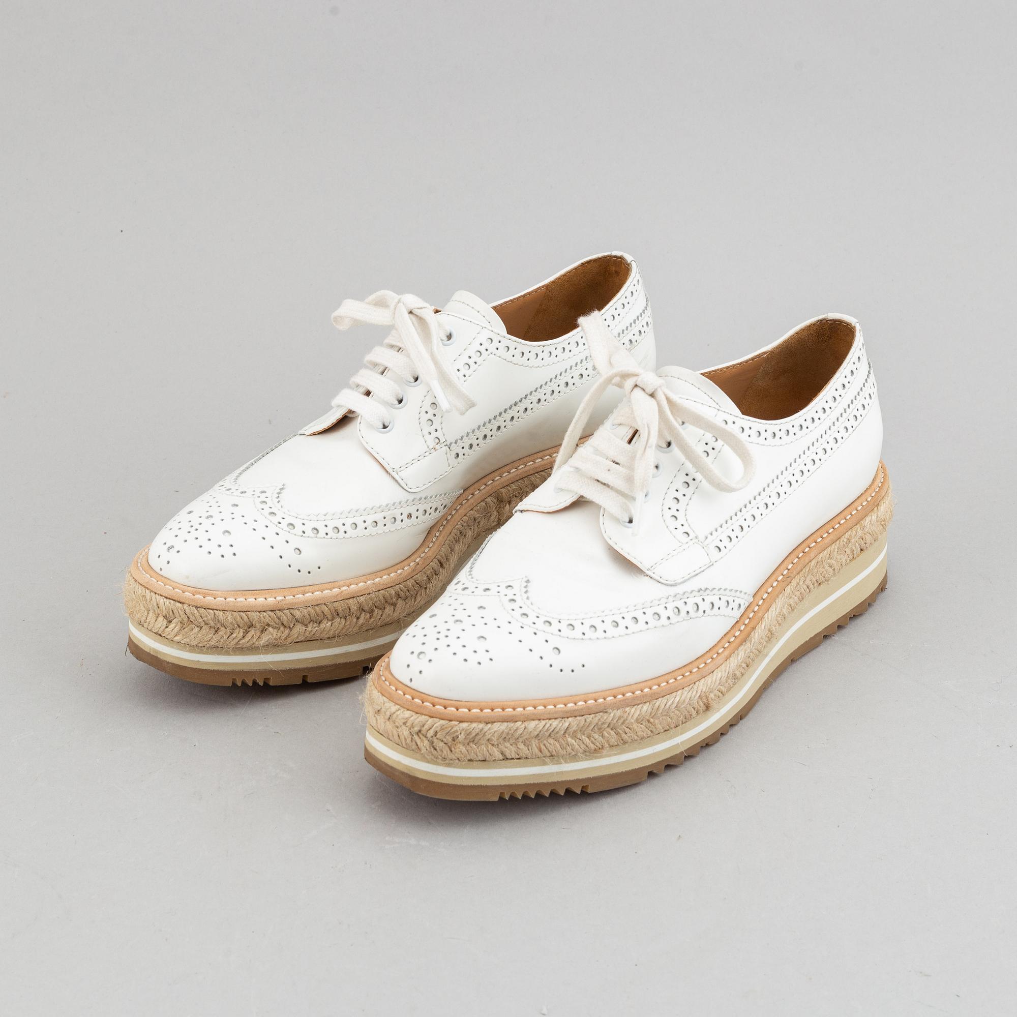 Prada, a pair of white leather brogues, size 36.