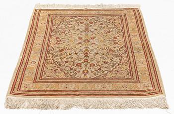 A Hereke silk rug, c. 130 x 87 cm.
